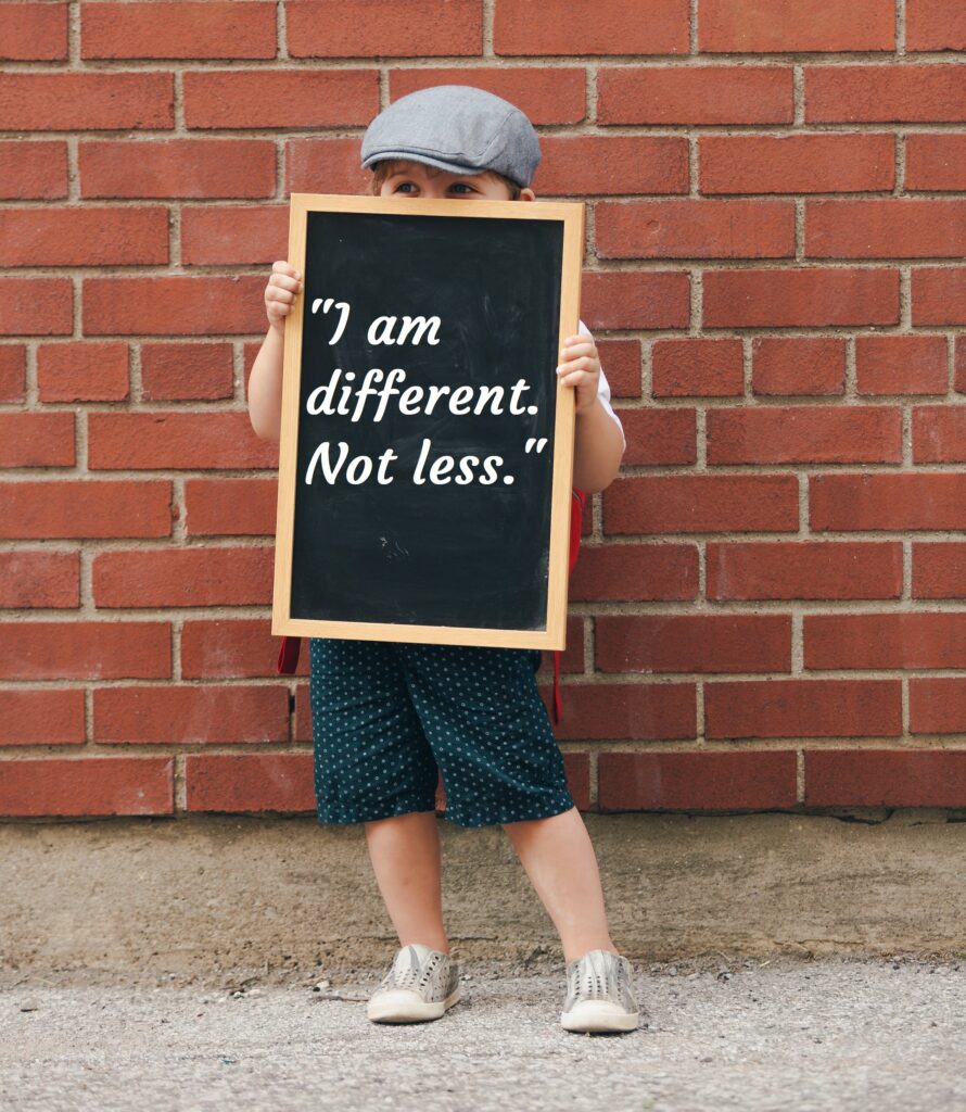 Kid holding slate in hand, Autism Awareness Day.