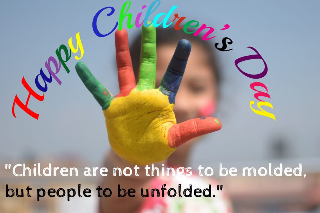 Girl with different colours on palm, Children's day quotes.