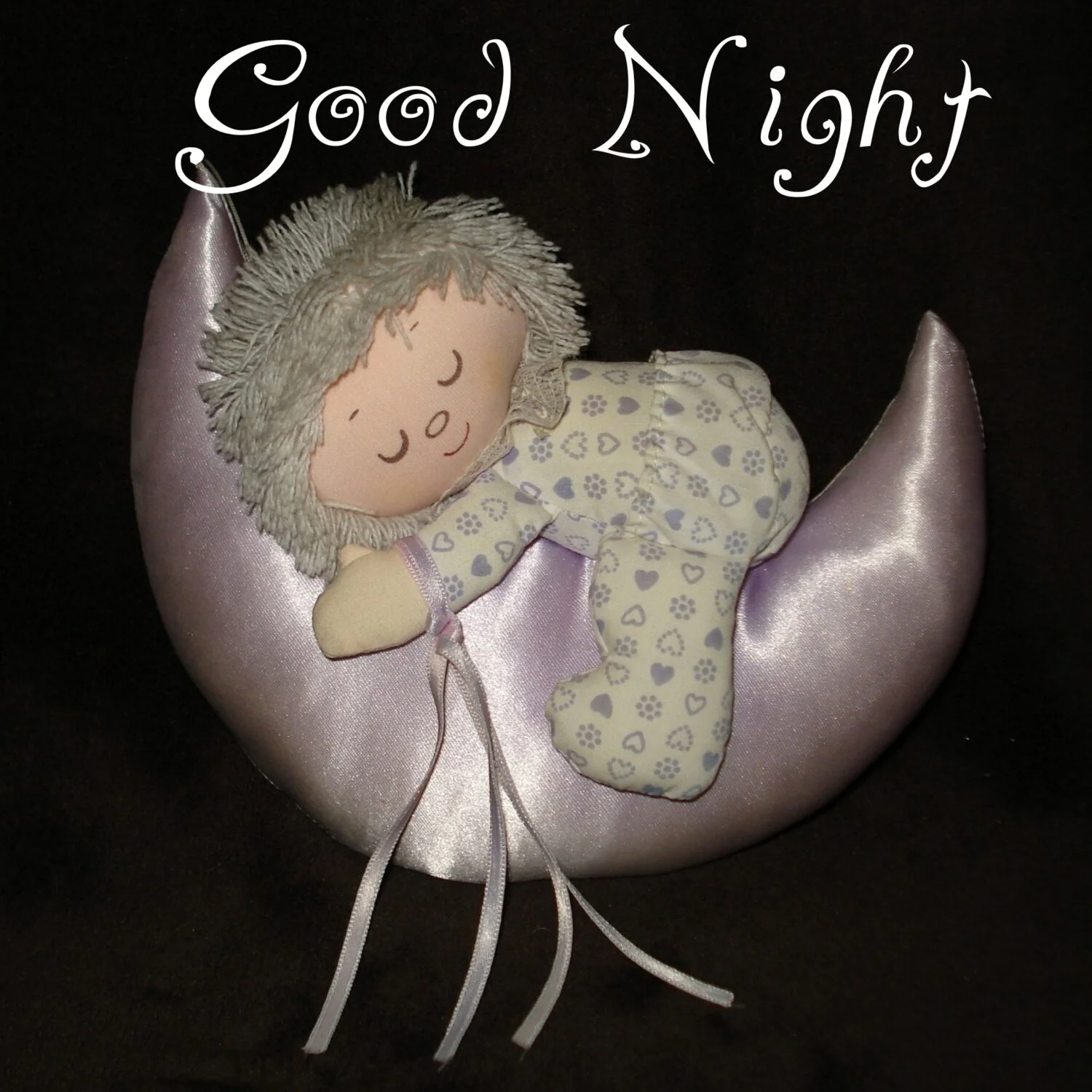 Doll sleeping on moon crescent shape pillow, Good night quotes and images.